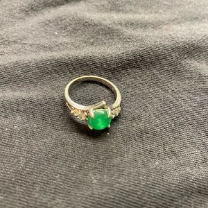 silver ring with green gem